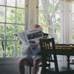 man reading newspaper